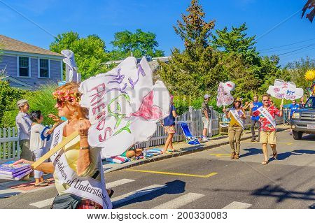 Provincetown, Massachusetts US - August 17, 2017 People walking in the 39th Annual Provincetown Carnival Gods and Goddess Parade on Commercial Street