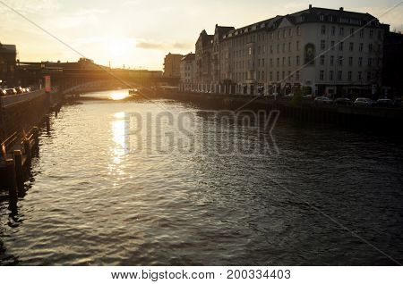 View Landscape And Cityscape With Weidendammer Bridge And Spree River In Sunset Time At Berlin City