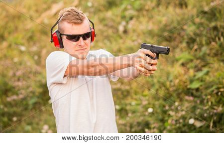 Handsome And Young Blond Policeman Professional Army Special Force Training Guy Shoot From Fire Arms
