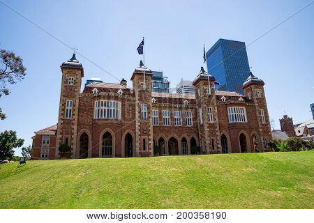 A view of Government House with Perth City Central Business district buildings on background Western Australia