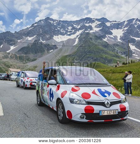Col du Lautaret France - July 19 2014: The vehicle of Carrefour during the passing of the advertising caravan on mountain pass Lautaret during the stage 14 of Le Tour de France 2014. Before the appearance of the cyclists there is a caravan of advertising