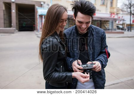 Street photo shoot. Photographers enjoy process. Creative stylish youth lifestyle. Modern young people outdoors