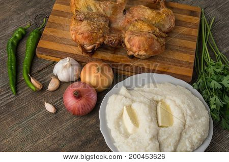 Fried Chicken, Ghomi And Vegetables On An Old Wooden Board, Georgia, Samegrelo