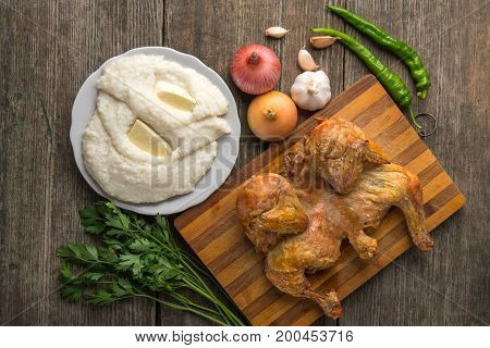 Fried Chicken, Ghomi And Vegetables On An Old Wooden Board, Georgia, Samegrelo