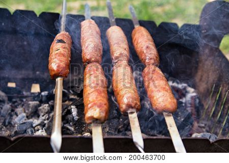 Outdoor Sausages Barbecue. Bbq On Brazier.