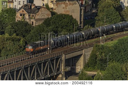 Trains on bridge over Labe in Usti nad Labem in hot summer evening