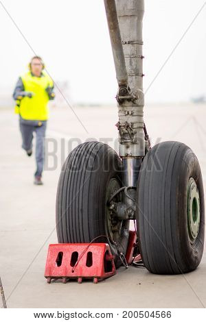 airport worker mechanic service maintenance chassis tire