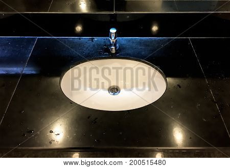 Wash basin in the public toilet .