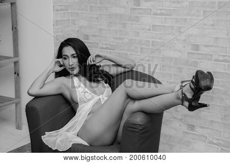Portrait of young woman brunette with beautiful nude topless breasts.
