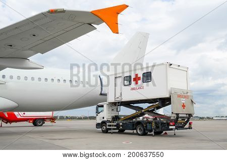 Airplane At The Airport With Loading Ladder For Disabled People