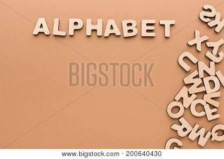 Wooden board with English alphabet letters. Sorter toy for child development and education.