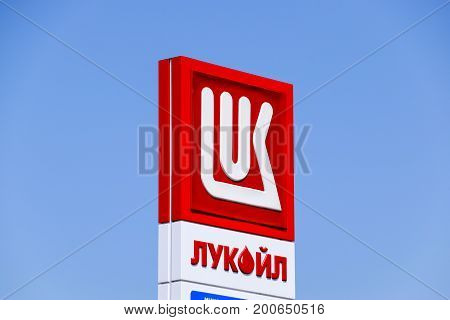 Logo Of The Company Lukoil. Gas Station Of The Oil Company Lukoil On The Highway.