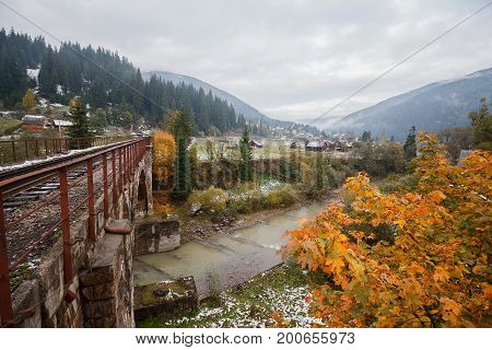 Old viaduct in the village of Vorokhta in the autumn season. Carpathians