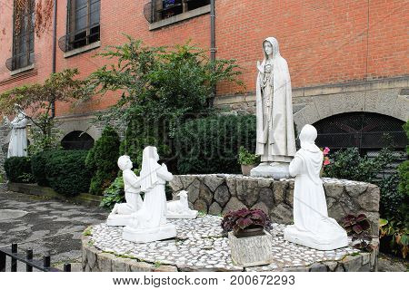 New York USA - September 27 2016: Holy statues outside the Church of St. Anthony of Padua a Catholic parish church in the Roman Catholic Archdiocese of New York located at 155 Sullivan Street