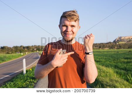 Activity tracker on a man's wrist on the street
