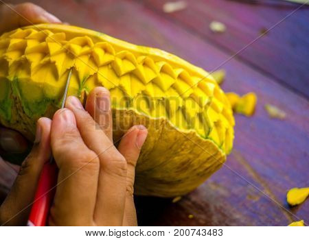 Thailand carved the pumpkin with on  hand