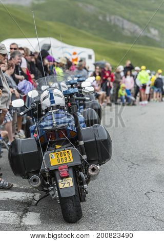 Col du Lautaret France - July 19 2014: Row of empty police bikes in front of the spectators on the side of the road on Col du Lautaret in Alps during the stage 14 of Le Tour de France 2014.