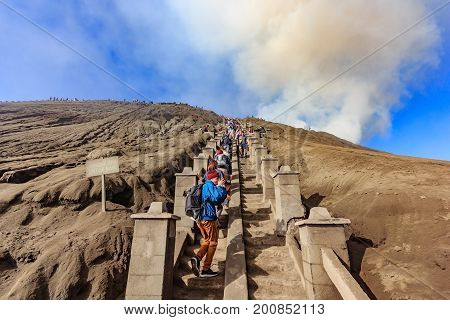 SURABAYA, INDONESIA - MAY 21, 2015: Unidentified tourist walking through on the craters of Gunung Bromo and Sumeru volcanoes in Java Indonesia