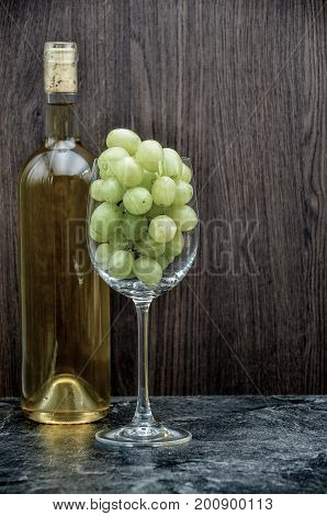 winebottle and glas with grape close up
