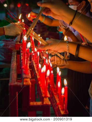 Burning red chinese candle in temple. New year ritual