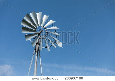 Old metallic windpump or water pumping windmill