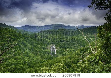 The most famous Khlonglan waterfall in deep forest top view in mountains with cloud and skyLandscape Thailand.