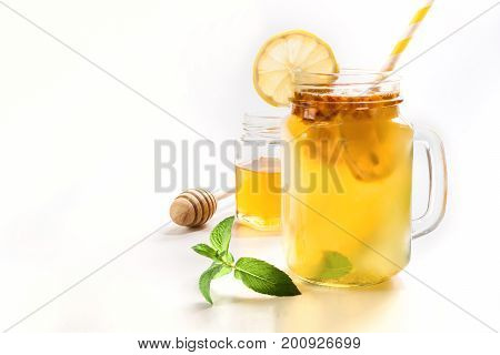 Healthy drink of seabuckthorn lemon and mint in mason jar on white background.