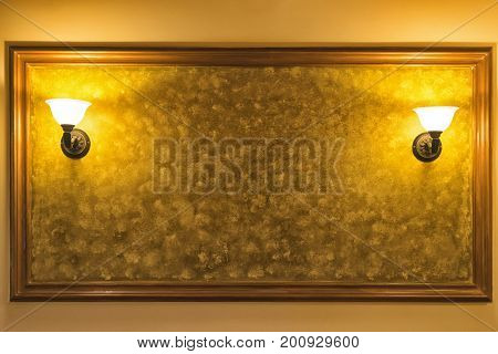 Old Vintage Lamp On The Wall With Framed Yellow Background