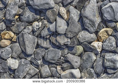 Picture of grey sea stones texture details.