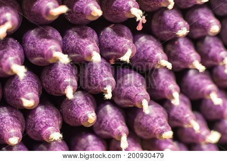 Colorful Stick Candles With Purple Tonality, Arranged In Shelves And Sorted By Color In A Candle Sho