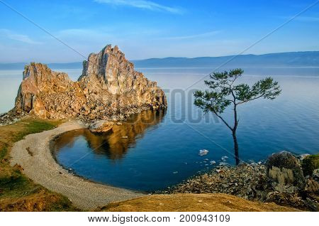 Summer sunset over Mountain Rock of Shamanka Burhan on Olkhon Island in Lake Baikal Russia