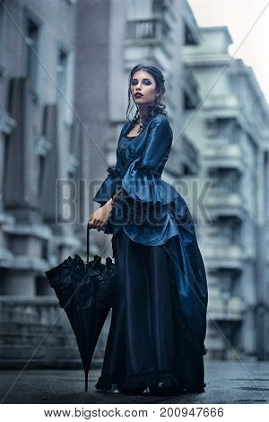 Outdoors portrait of a victorian lady in blue