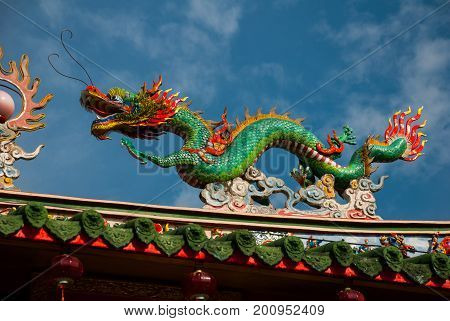 Multi-colored Dragons Against A Blue Sky. Chinese Temple Tua Pek Kong. Miri City, Borneo, Sarawak, M