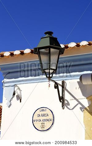 Querenca Algarve Portugal - October 10 2014 : Lantern on the side of a building in Querenca in the Serra de Monchique mountain range of the Algarve