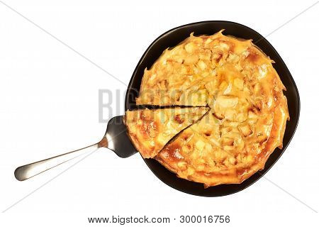 Homemade Whole Round Apple Pie, Top View. A Piece Can Be Taken Out On A Stainless Steel Cake Server.