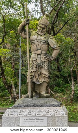 Hong Kong, China - March 7, 2019: Lantau Island. Po Lin Buddhist Monastery. Stone Statue Of General 