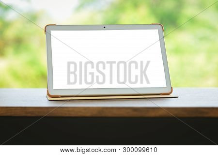 Tablet On Table Isolated Screen / Digital Tablet Compute Or Laptop Blank Screen On Table Nature Gree