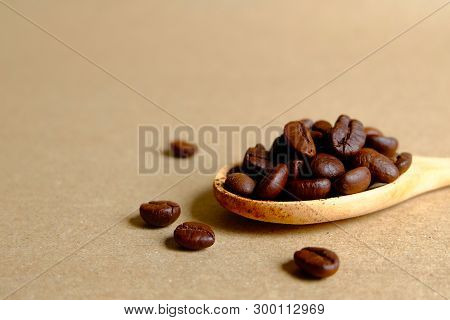 Coffee Beans In Wooden Spoon, Roasted Coffee Beans