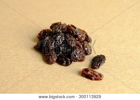 Dried Raisins On Brown Background, Black Raisin