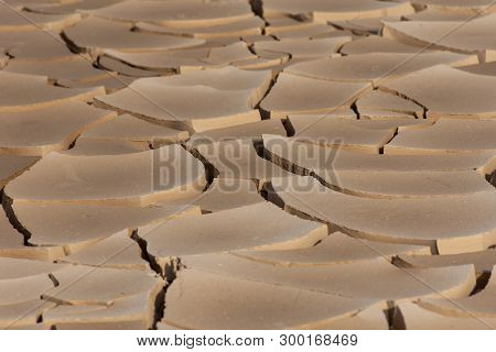 Dried Mud Design In The Sunshine In The Desert Of The United Arab Emirates (uae) After A Flood And S