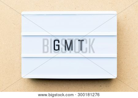 White Lightbox With Word Gmt (abbreviation Of Greenwich Mean Time) On Wood Background