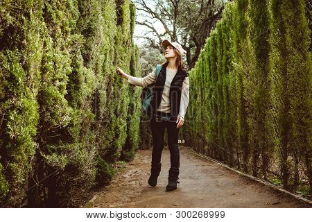 Young Woman Walking In The Park Labyrinth