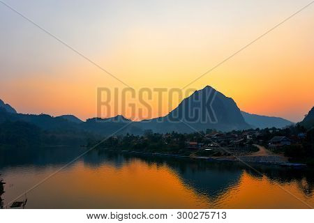 House At The River , Sunset On The Nam Ou River In Nong Khiaw, Laos