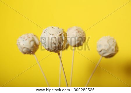 Sweet Candy Dessert, Cake Pop. Yellow Background