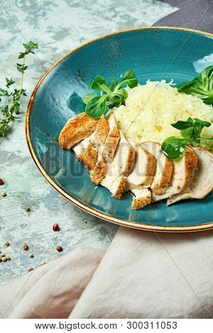White Rice With Chicken Breast. Rizotto. Gray Light Textured Background. Beautiful Serving Of Dishes