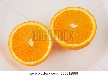 Fresh Slised Oranges Isolated On The Gray Background