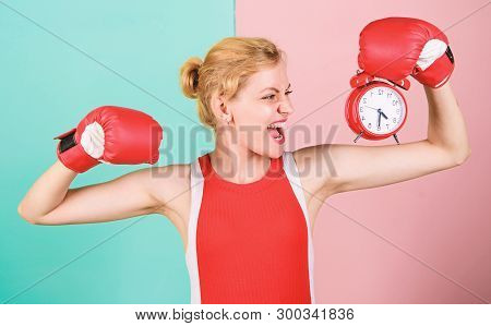 Girl Athlete Boxing Gloves And Alarm Clock. Sport Lifestyle And Healthy Regime. Habits And Regime Co