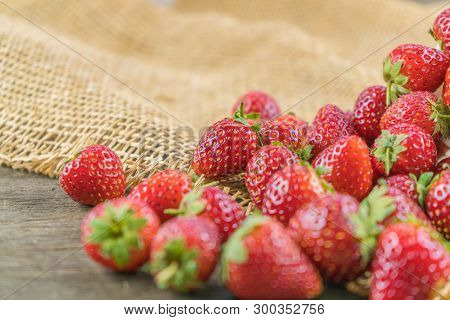 Fresh Red Strawberry Fruit On Sack Cloth.