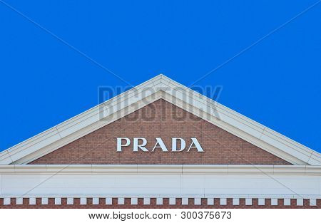 2019 March 26. Tochigi Japan. A Modern Design Of Prada Brand Name On Gable Roof Brick Wall With Blue