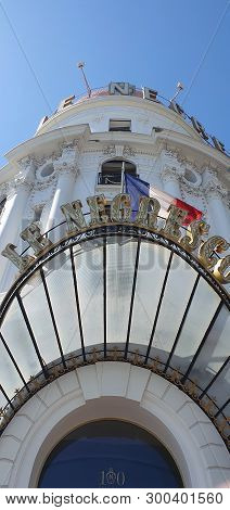 Nice, France - May 1, 2019: Famous Entrance Of Hotel Negresco Facade And Logo On Promenade Des Angla